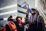 Black protesters in medical masks on street