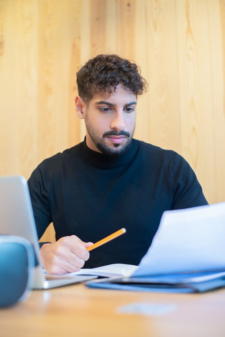 A Man Looking At Business Papers