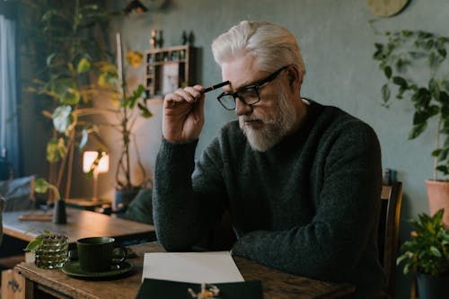 A Man Sitting at the Table