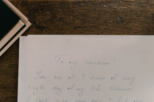 Free A Handwritten Letter on White Paper Stock Photo