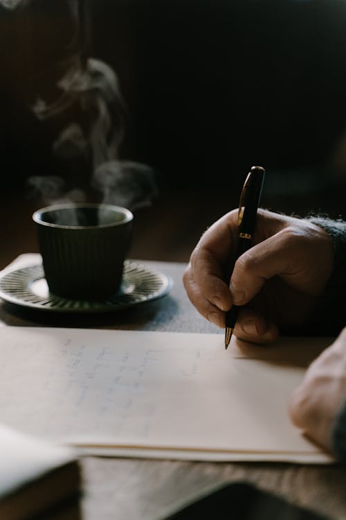 A Person Making a Handwritten  Letter