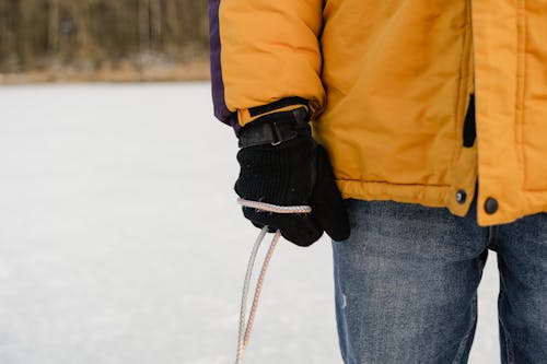 Free Person Wearing Gloves Holding a Rope Stock Photo