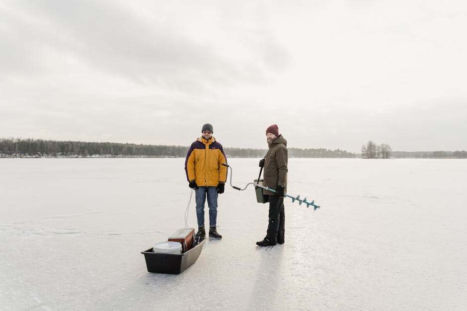 Ice Fishing On Frozen Lake Ice Stock Photo 555295201