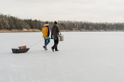 Men Walking in Frozen Lake 