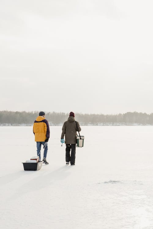 Men Walking on the Snow