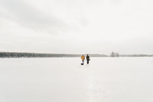 Explorer Walking on Frozen Lake