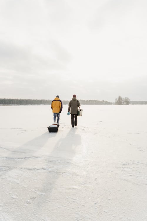 Men Walking on the Snow