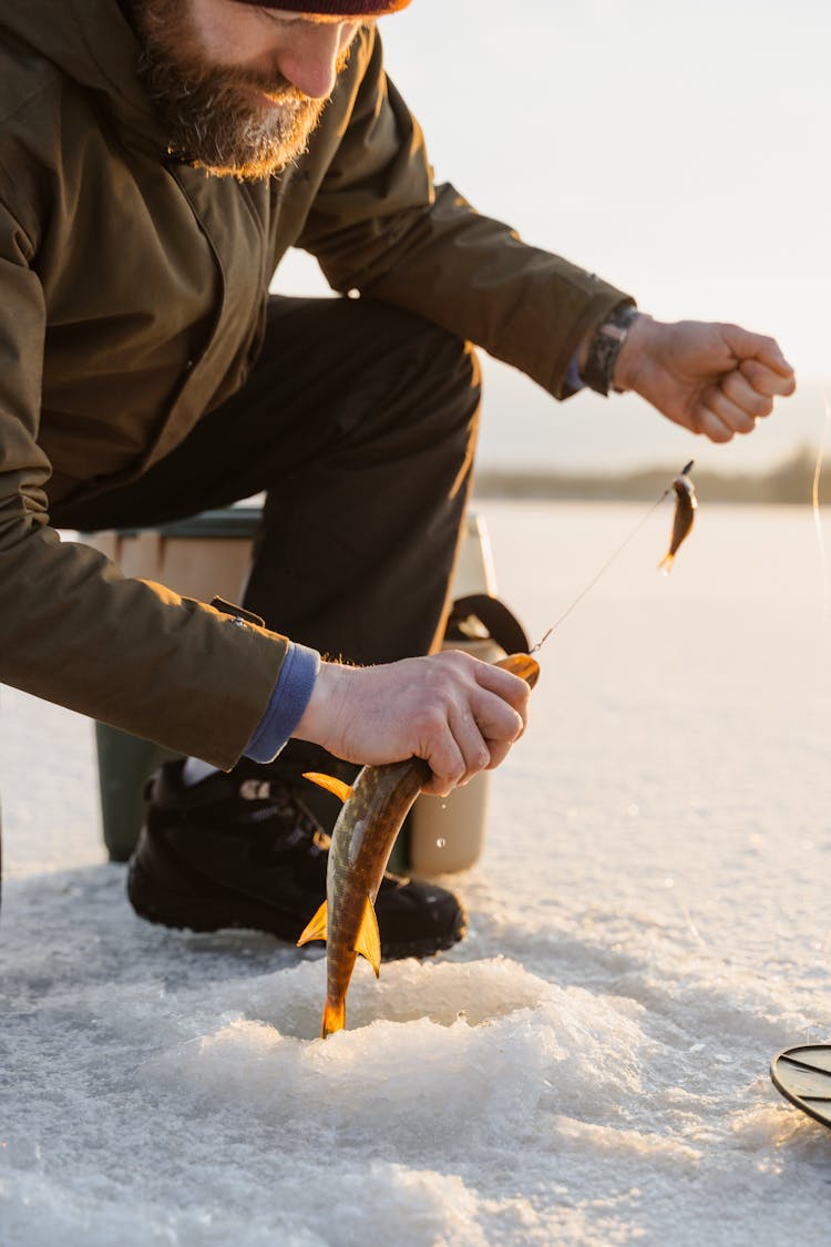 A Bearded Man Holding A Fish