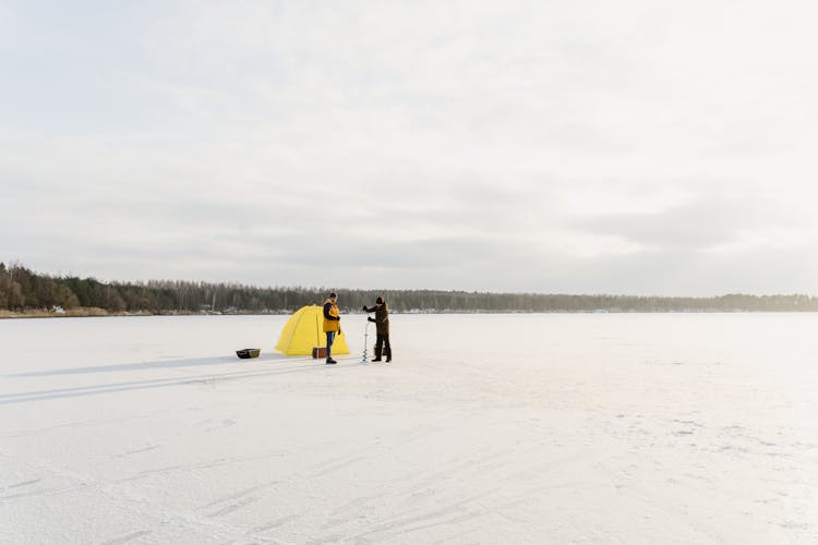 Men Fishing On The Lake