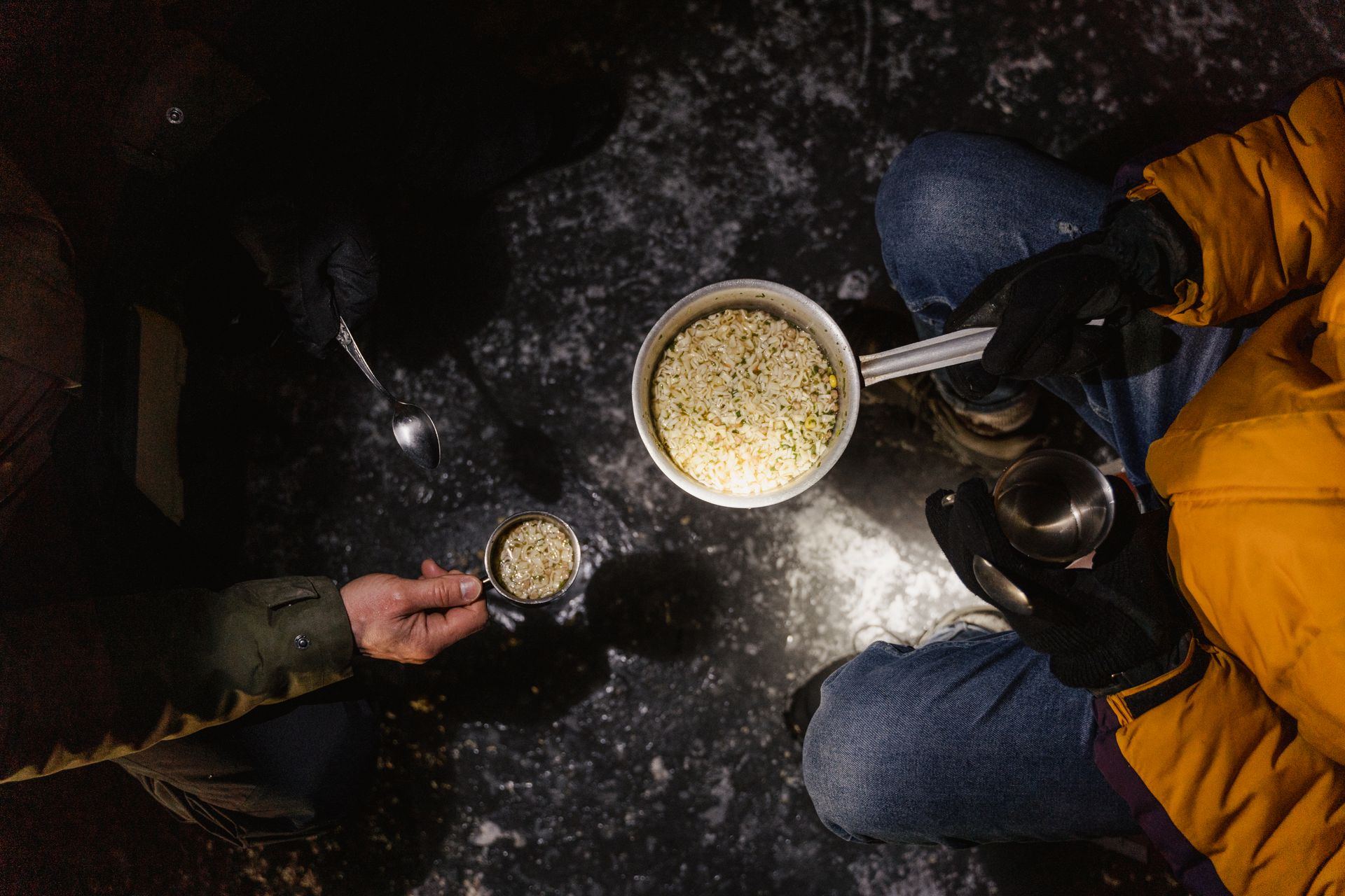 A Person Holding Cooking Pot with Food