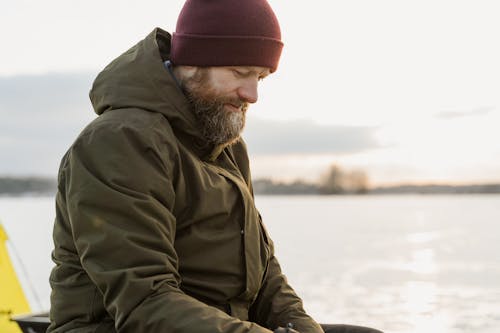 Man Wearing a Hoodie Jacket Looking Down