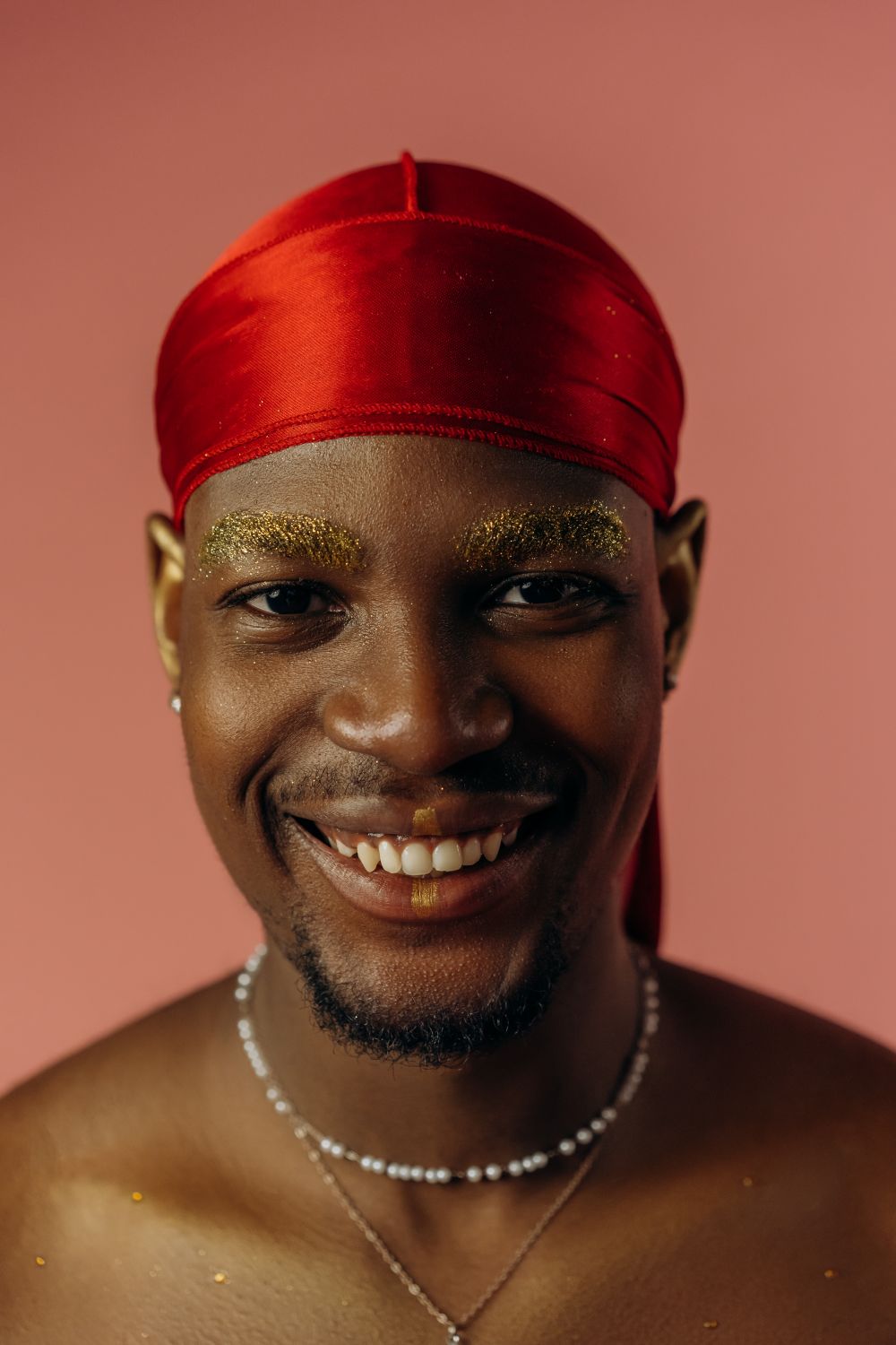 Shirtless Man Wearing Red Durag Smiling · Free Stock Photo