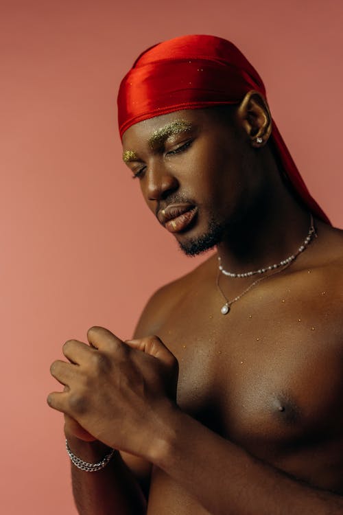 Shirtless Man Wearing Red Headscarf