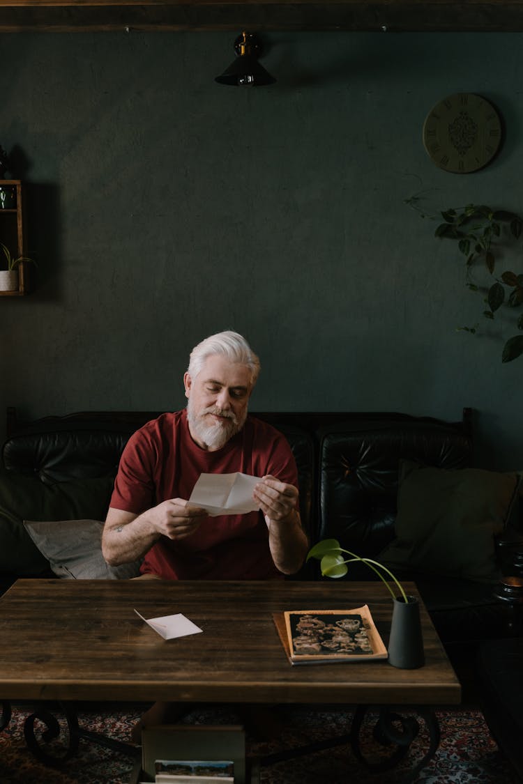 A Man Reading A Letter