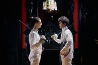 Men Fencers Looking at each other while Holding their Fencing Foils