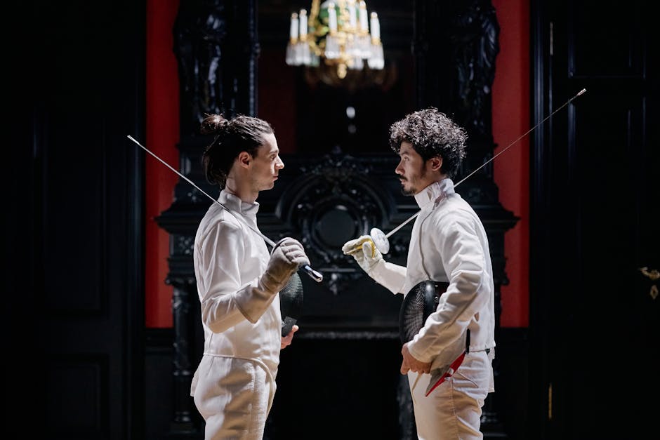 Two fencers in full gear engage in a focused duel in an ornate indoor setting.