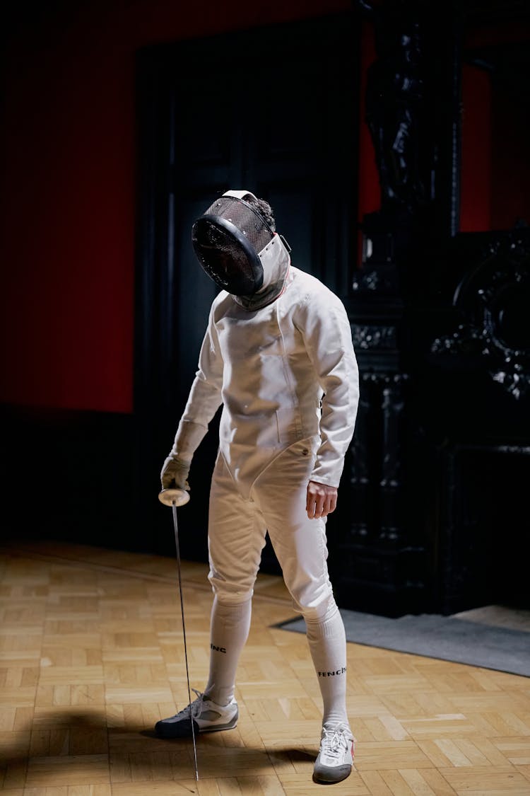 A Fencer Holding A Foil