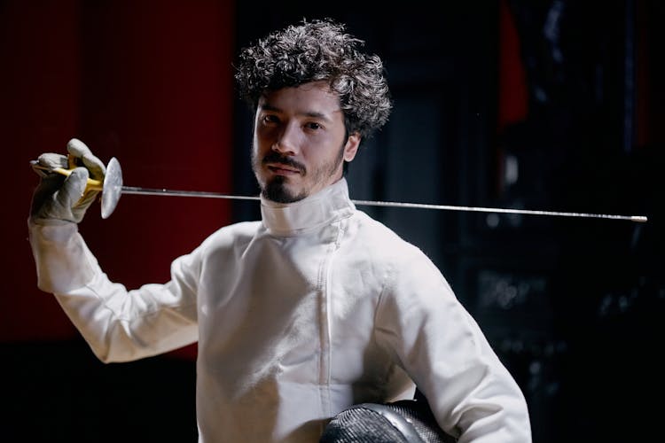 A Fencer Holding A Foil