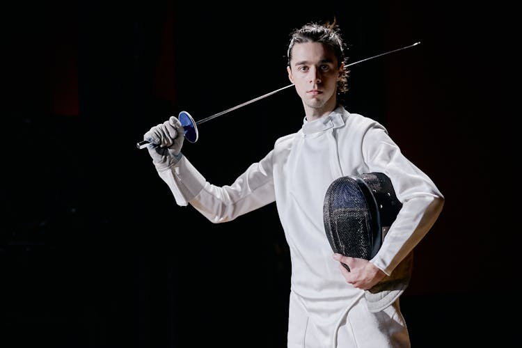 A Man Holding His Fencing Sword