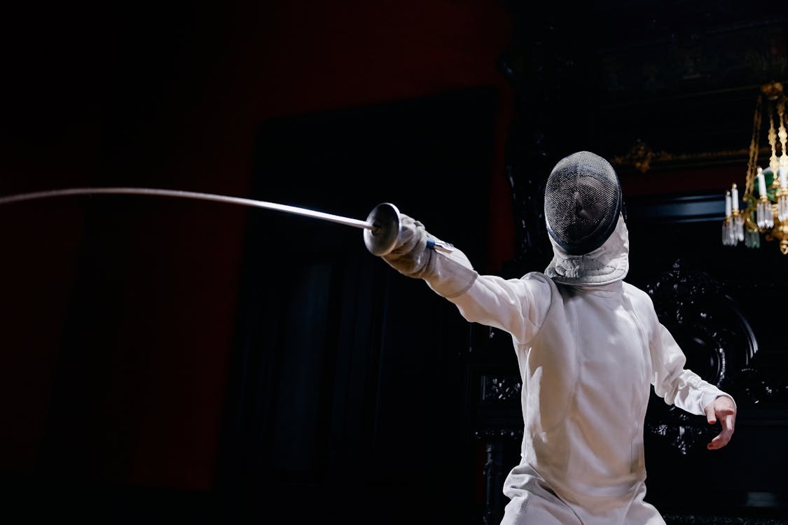 Free A Fencer Holding a Foil Stock Photo