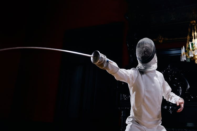 A Fencer Holding A Foil