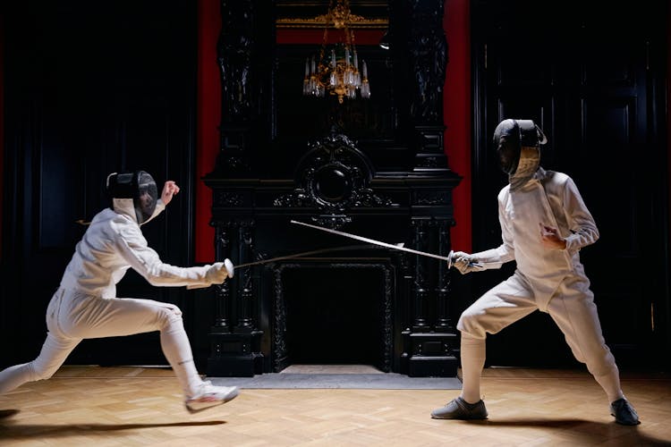 People In Playing Fencing