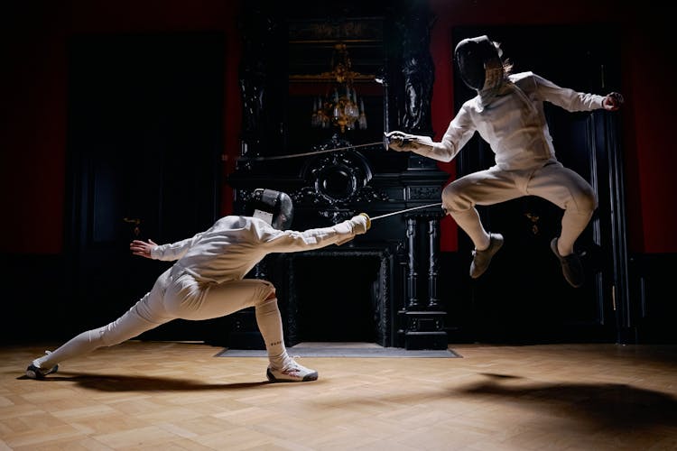 A Fencer Jumping In A Duel