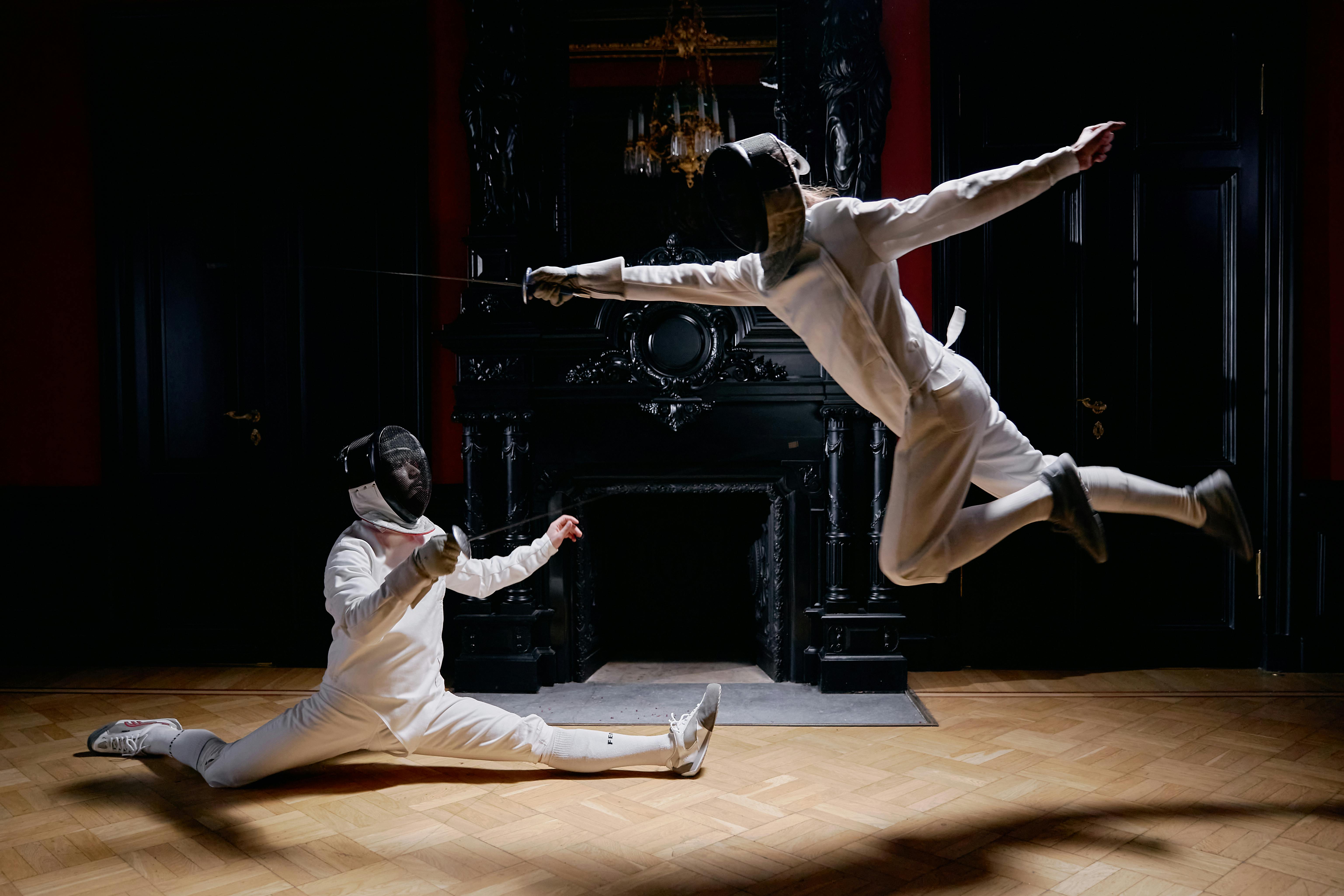 jump shot of fencers in a duel