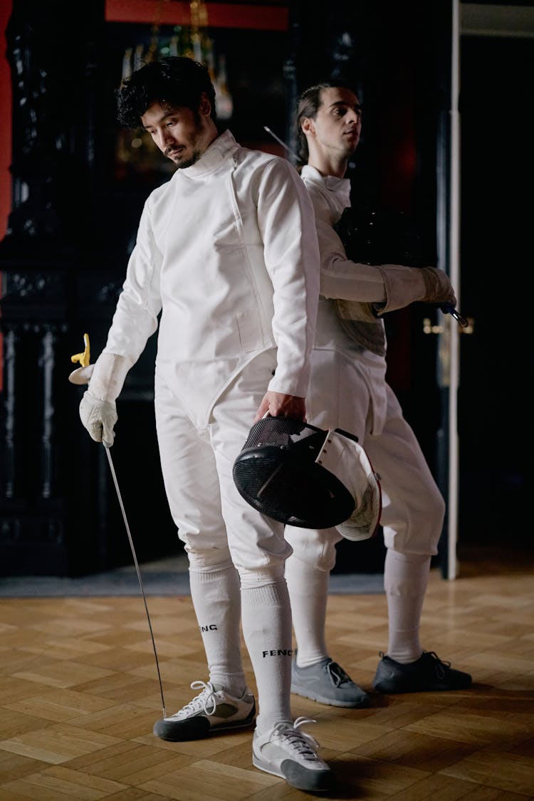 Two Men In Whtie Fencing Outfits