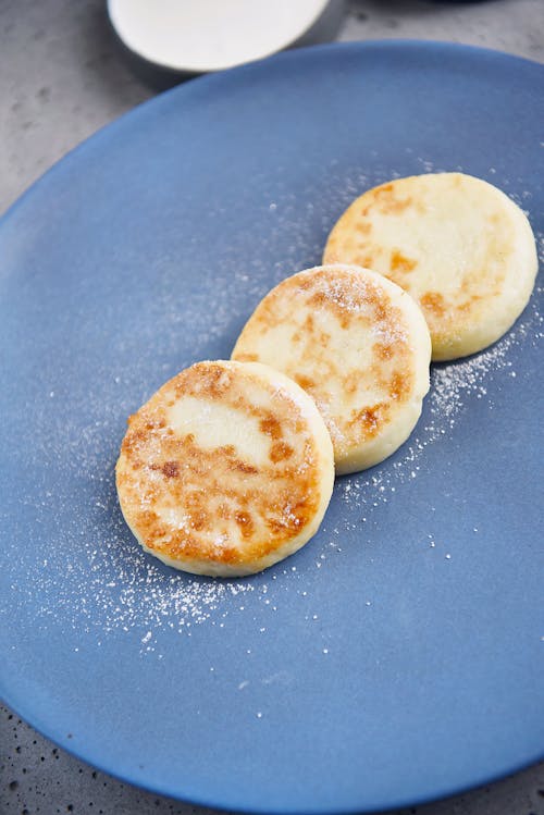 Breads With Sugar on Blue Ceramic Plate