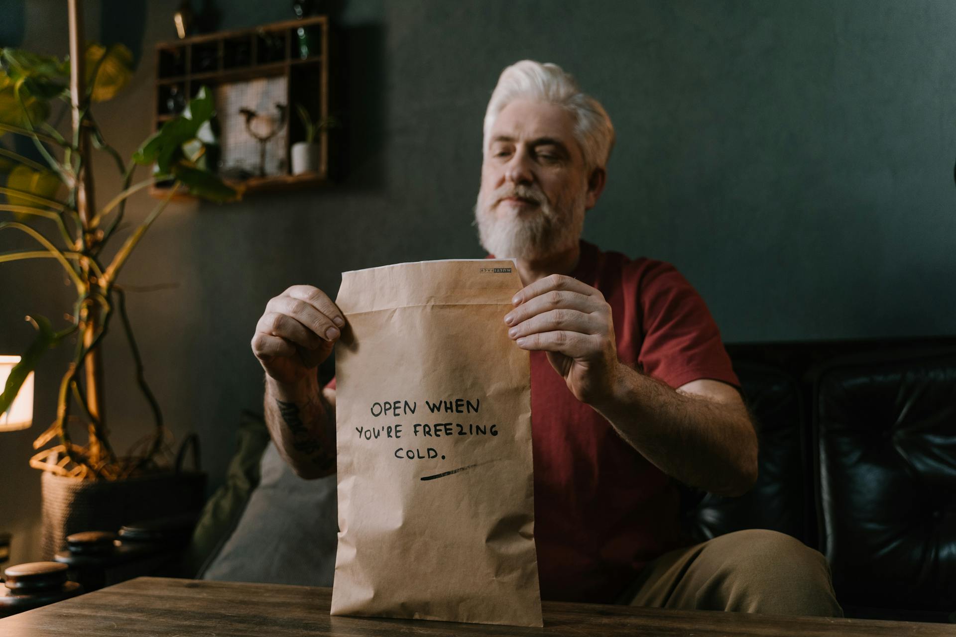 Elderly Man Closing a Surprise Parcel