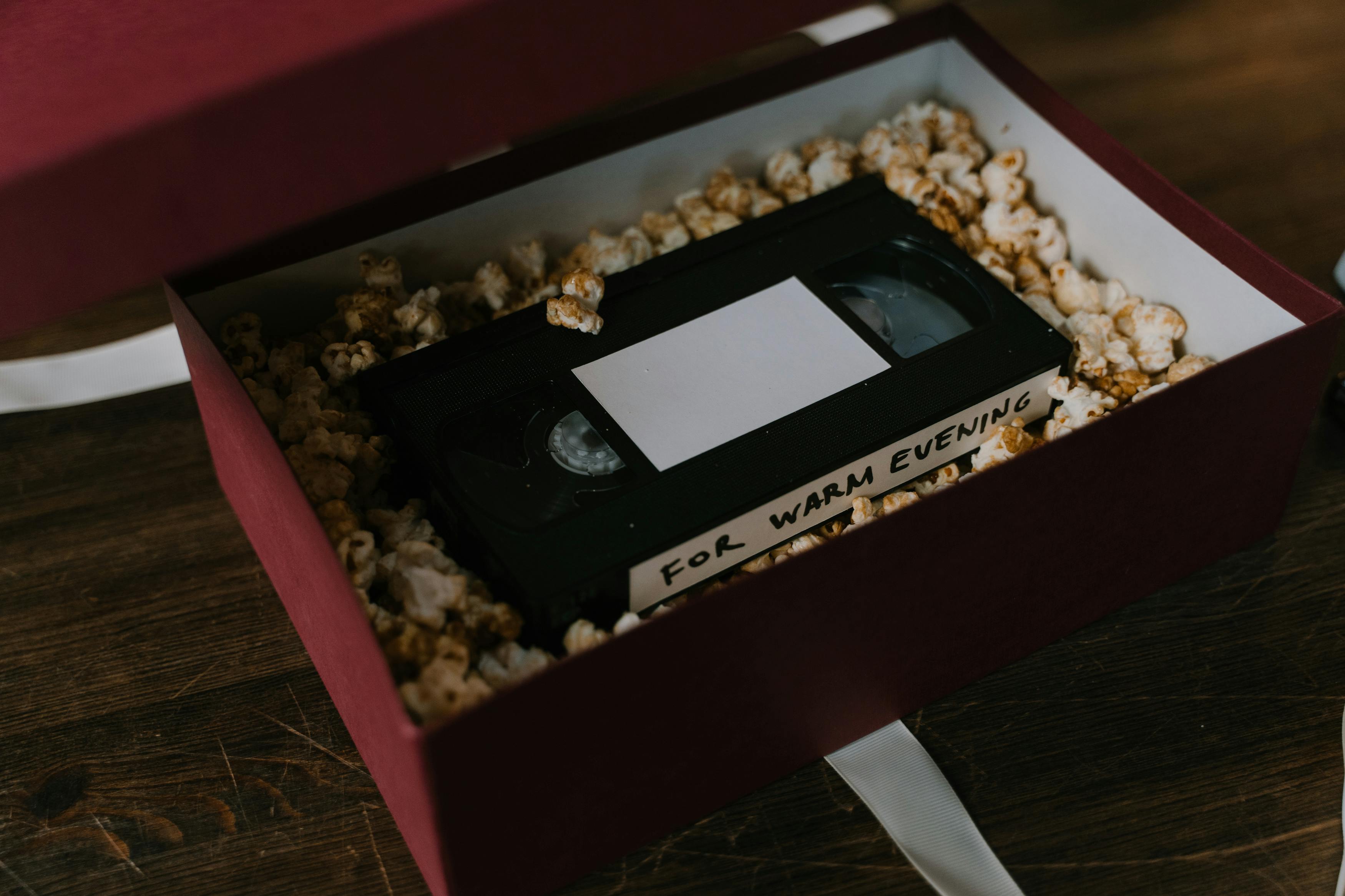 popcorn and a vhs tape inside a cardboard box