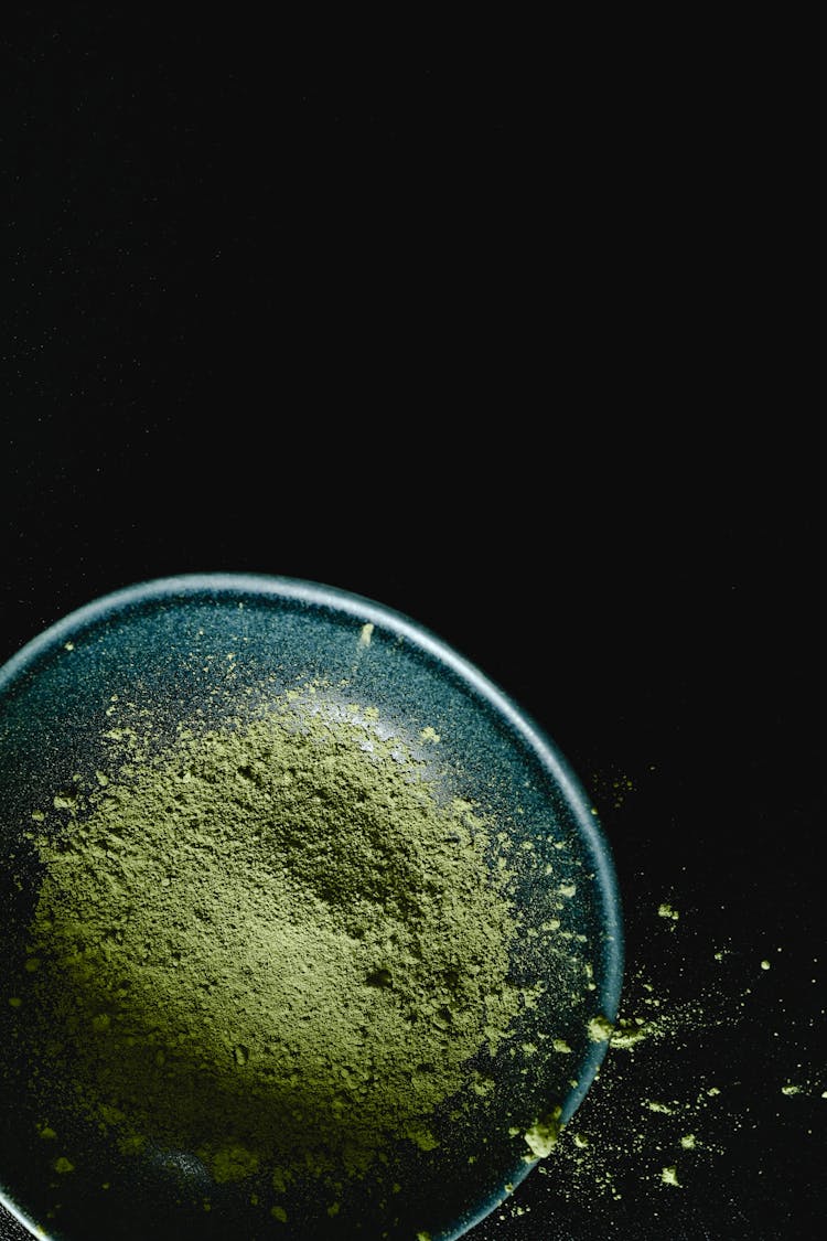 Green Powder On Blue Bowl