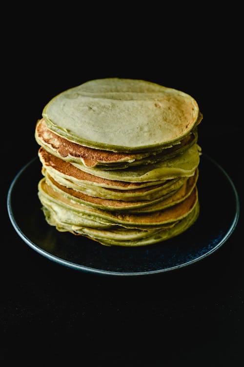 Photo of Stacked Pancakes on Black Background