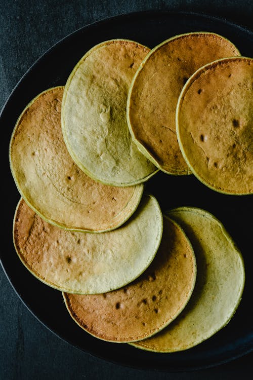 Close Up Photo of Pancakes on Black Plate