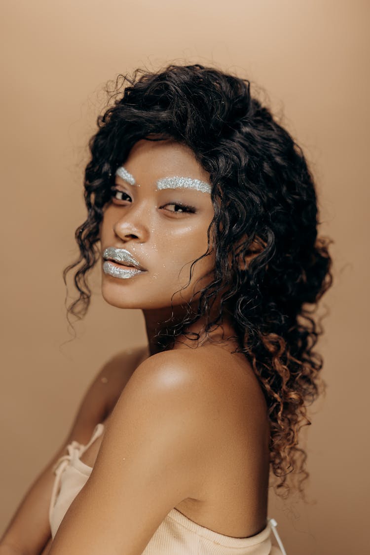 Portrait Photo Of A Woman With Glitter Makeup