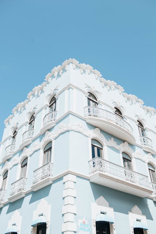 White and Blue Concrete Building Under Blue Sky