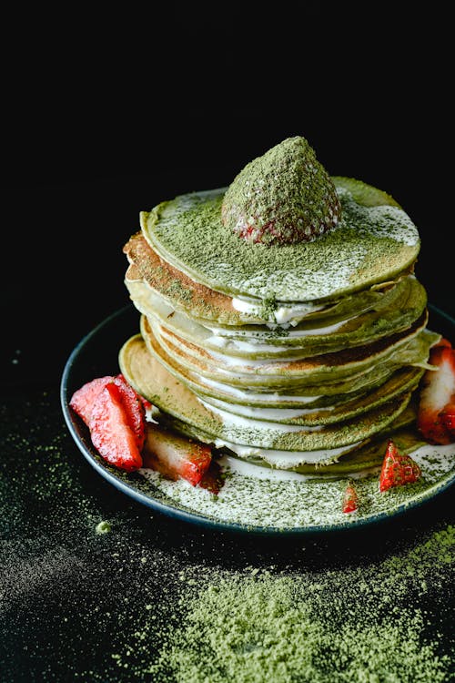 Stack of Pancakes with Matcha Powder and Strawberry