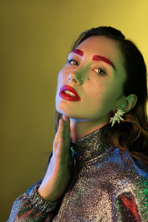 Close-Up Shot of a Pretty Woman in a Glitter Jacket Posing