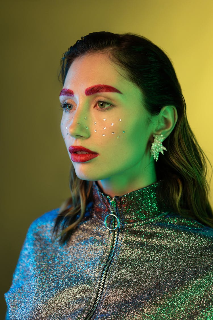 Woman With Sequence On Face And Red Lipstick