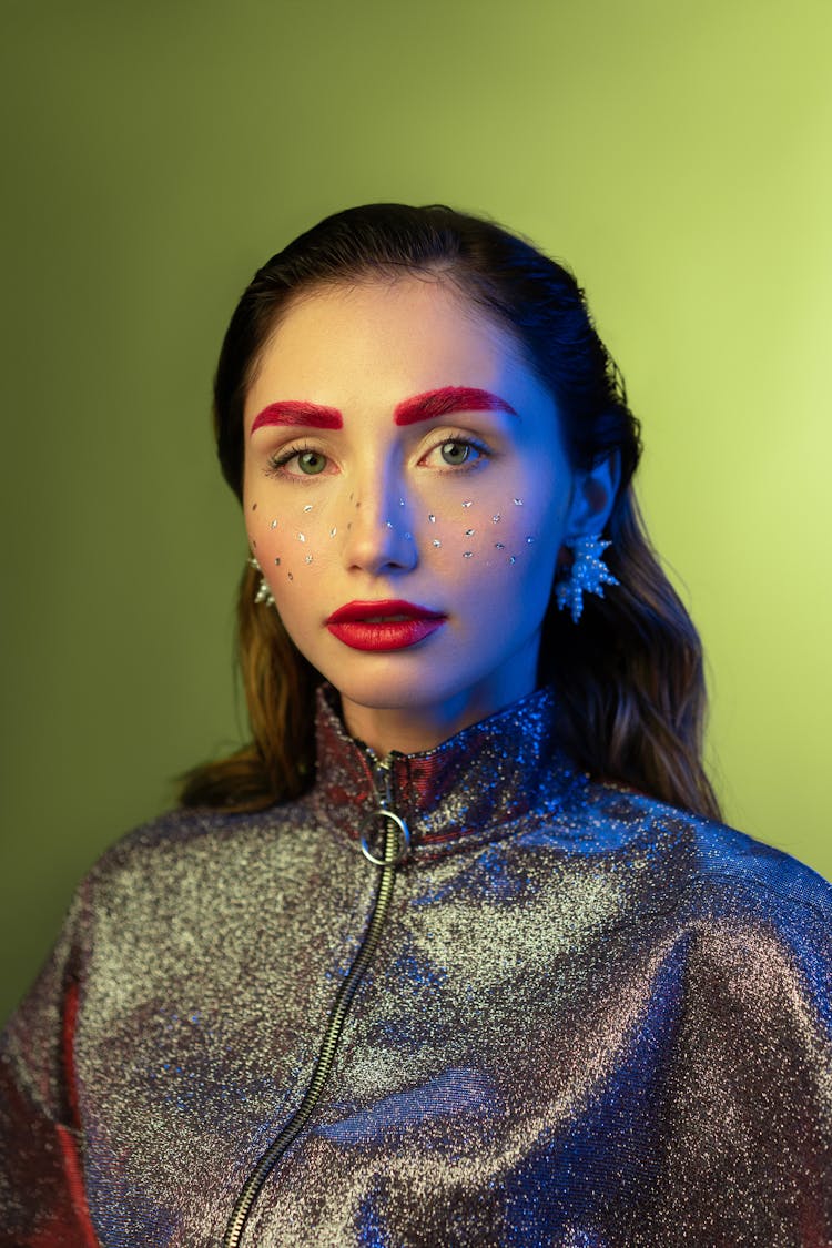 Woman With Sequence On Face And Red Lipstick