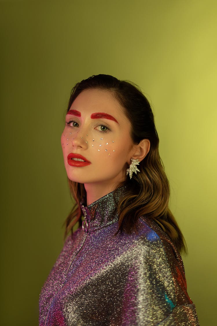 Woman With Sequence On Face And Red Lipstick