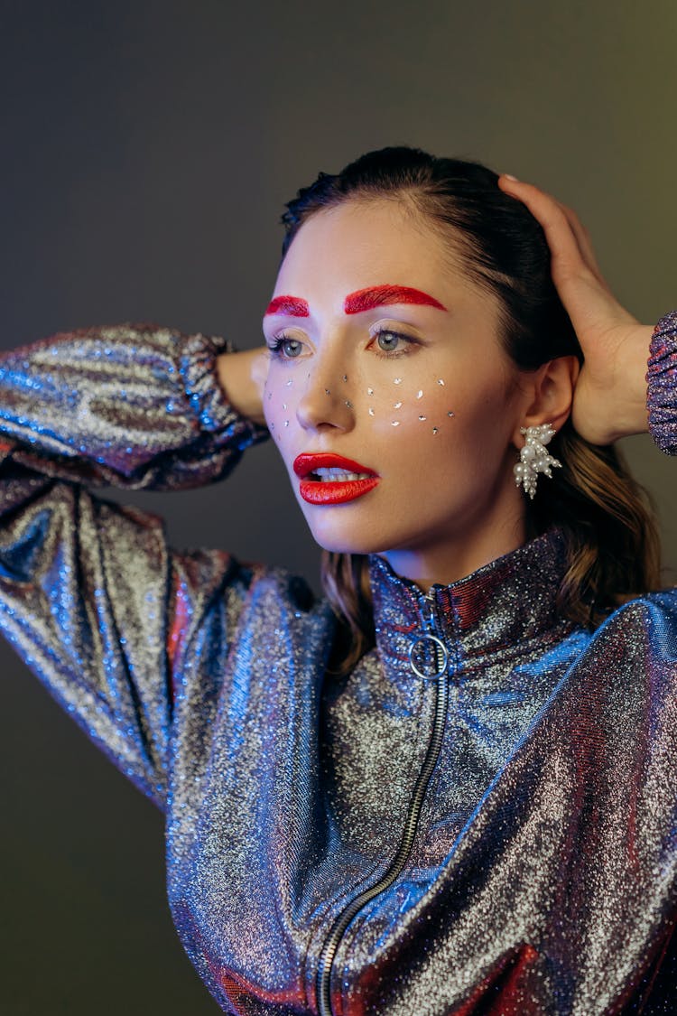 Woman With Sequence On Face And Red Lipstick Posing