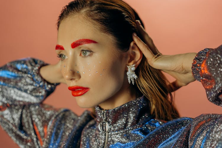 Woman With Red Lipstick And Red Eyebrows