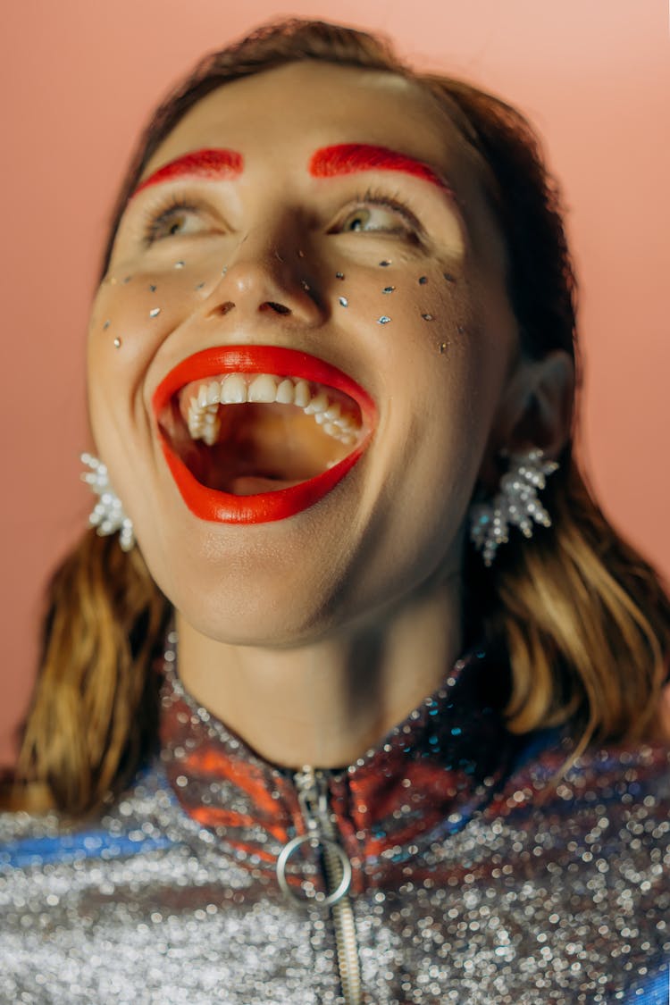 Close Up Photo Of Woman With Red Eyebrows And Lipstick And Open Mouth