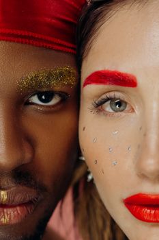 Close-up portrait of diverse models with vibrant and creative makeup highlighting unity and beauty.
