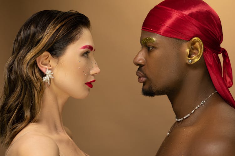 Man In A Red Headscarf And A Woman With Red Eyebrows 