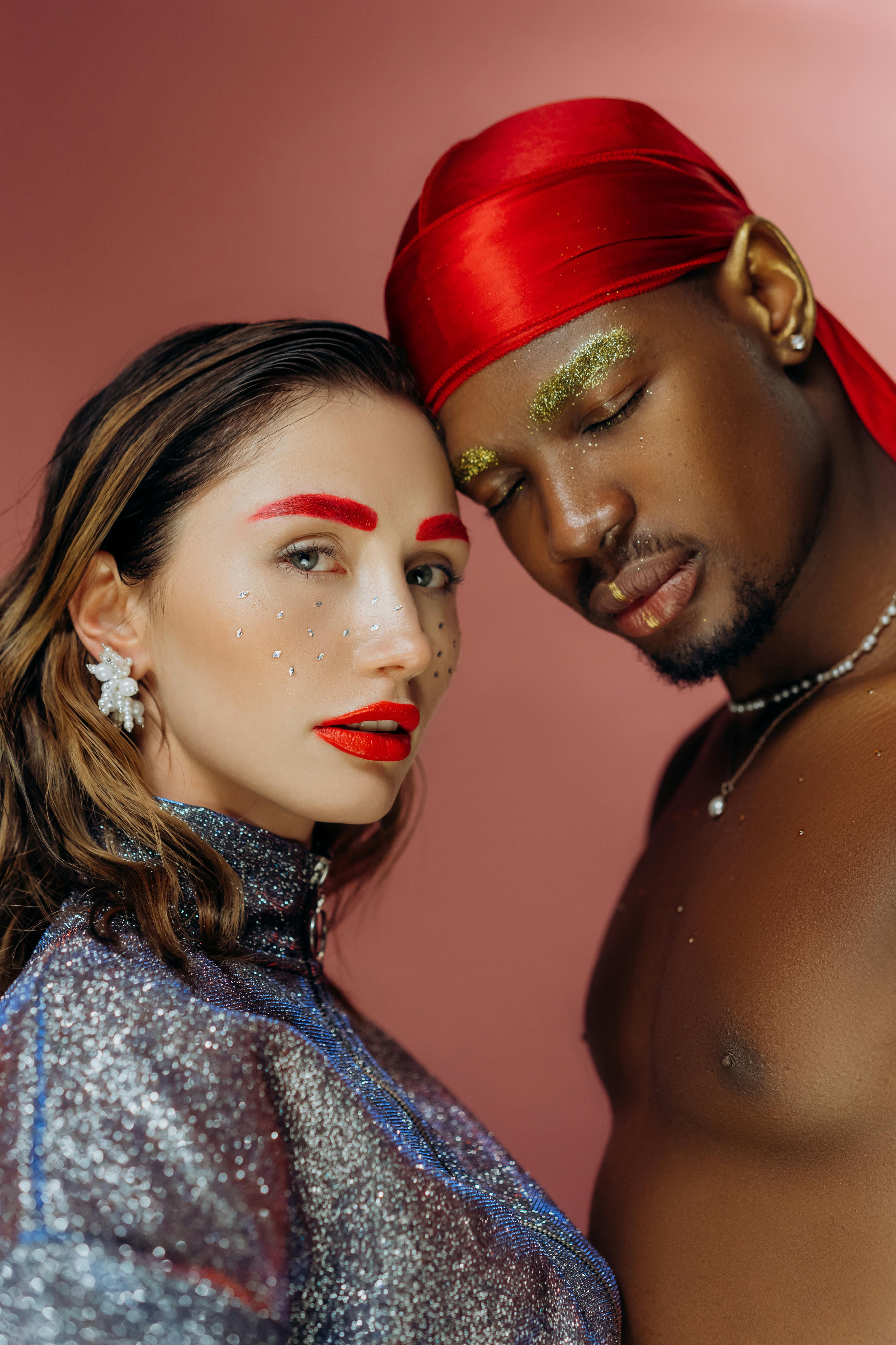 man and woman wearing red and white santa hat