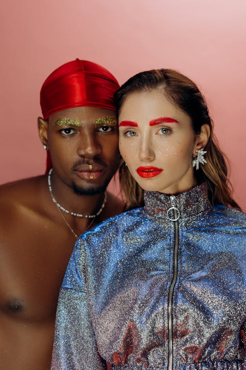 Man and Woman Wearing Red Hat