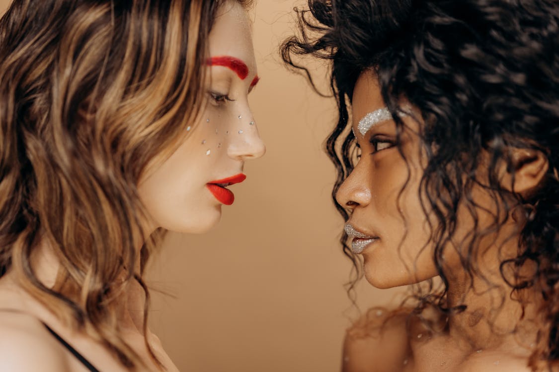 Side View of Two Women with Makeup
